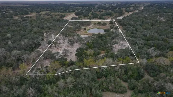 a aerial view of a house with a yard