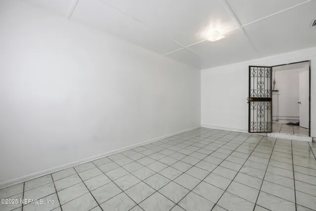 a view of an empty room and window