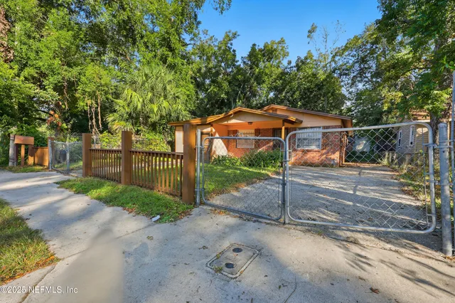 a view of a house with a street
