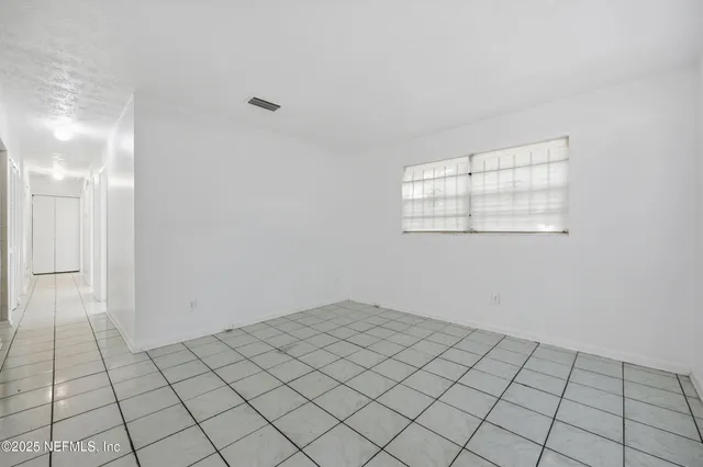 a view of an empty room and window