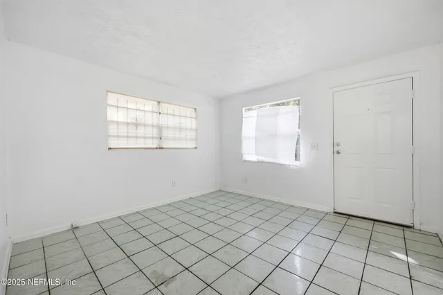 an empty room with windows