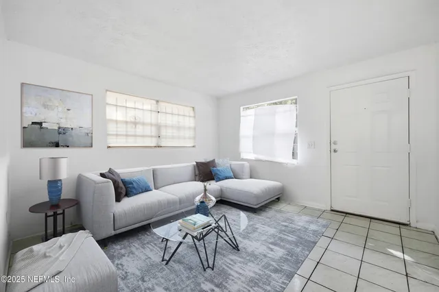 a living room with furniture and a window
