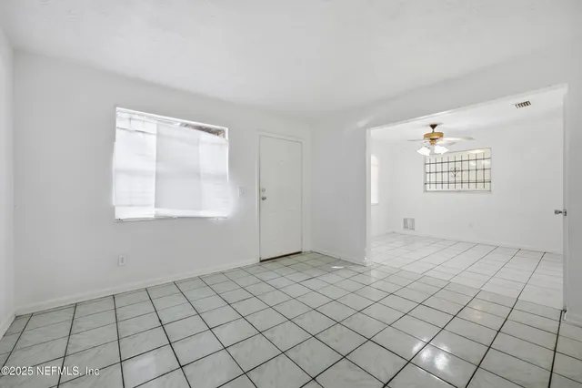 a view of an empty room and window