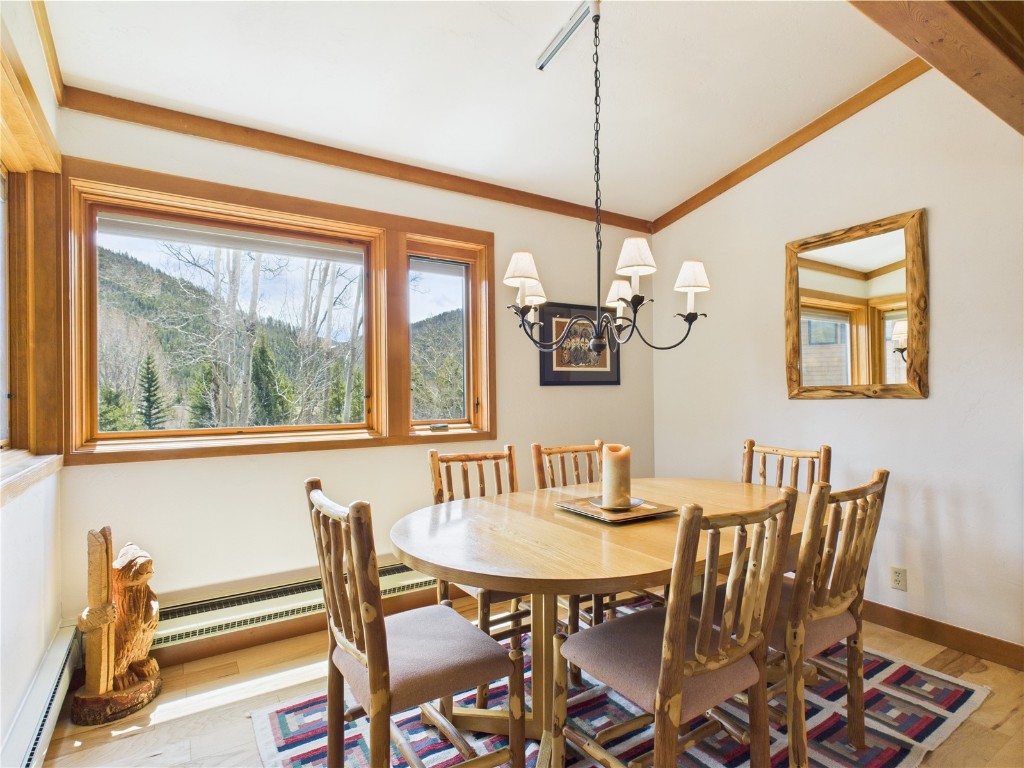 620 Tennis Club Road, Unit 1339 Keystone, CO 80435 - Photo 19 of 49 Bright dining room with picture windows framing scenic forest views