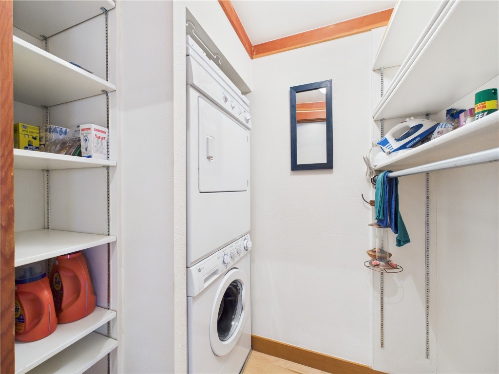 620 Tennis Club Road, Unit 1339 Keystone, CO 80435 - Photo 32 of 49 Dedicated laundry room with stacked washer/dryer and built-in shelving