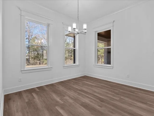 a large kitchen with stainless steel appliances kitchen island granite countertop a sink and cabinets
