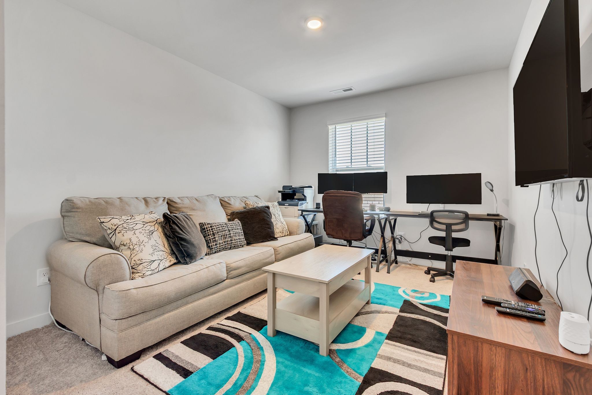 2736 Fordham Street Columbia, TN 38401 - Photo 12 of 15 a living room with furniture a flat screen tv and a window