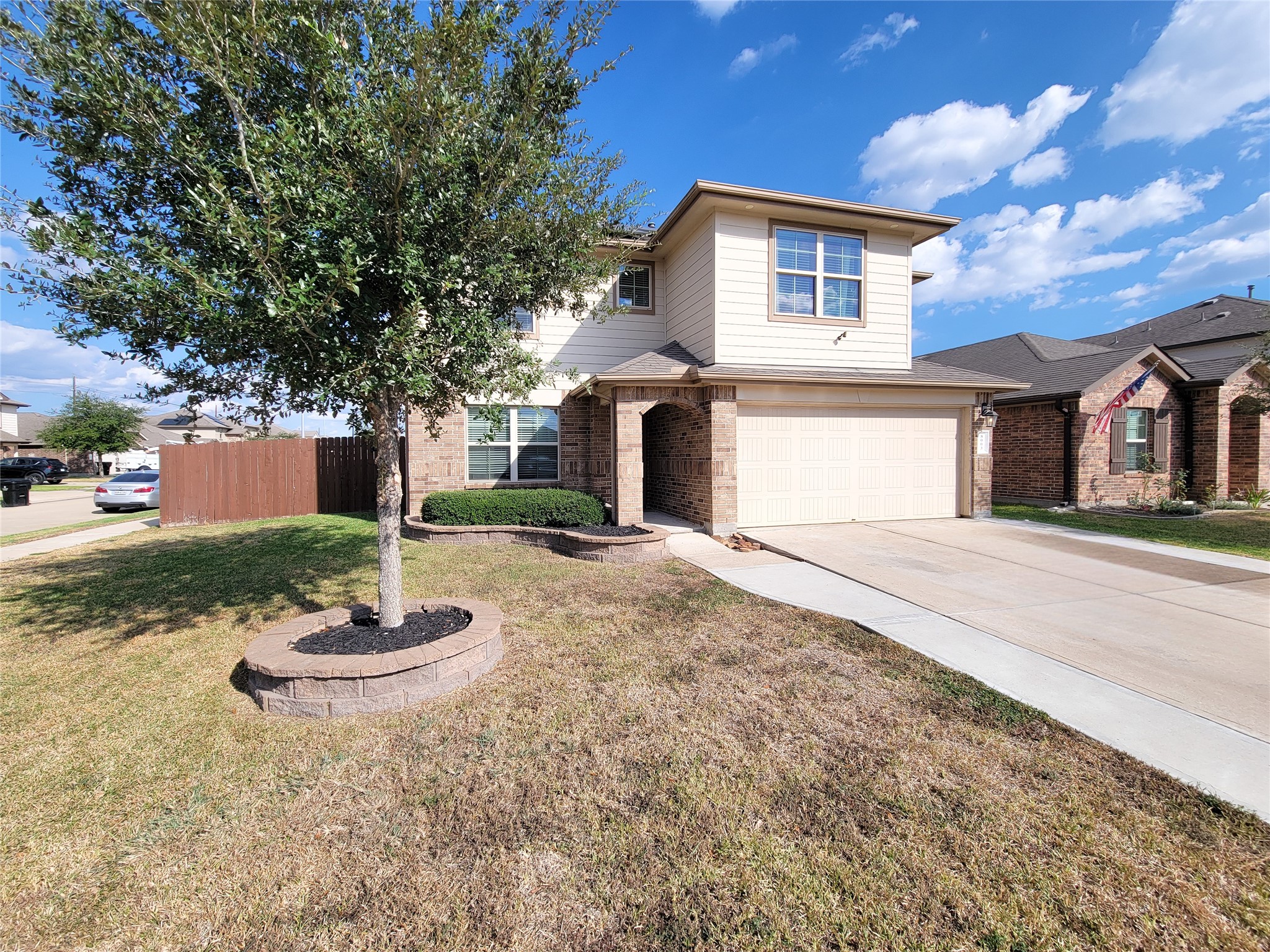 8003 Ecru Lane Rosharon, TX 77583 - Photo 3 of 43 a front view of a house with a yard and garage