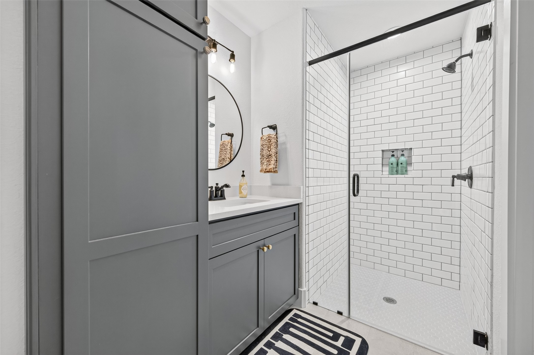 10915 Ruger Road Willis, TX 77378 - Photo 41 of 50 a bathroom with a shower and a sink