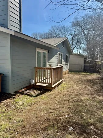 a view of a backyard of the house