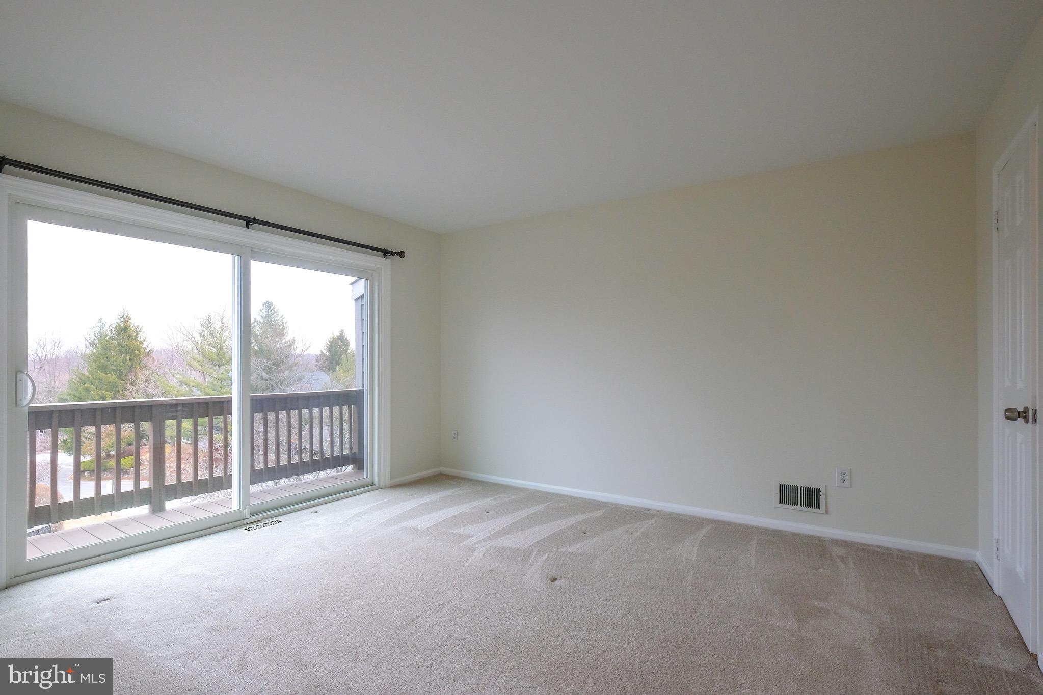 35 C Chicopee Drive Princeton, NJ 08540 - Photo 16 of 24 an empty room with wooden floor and windows