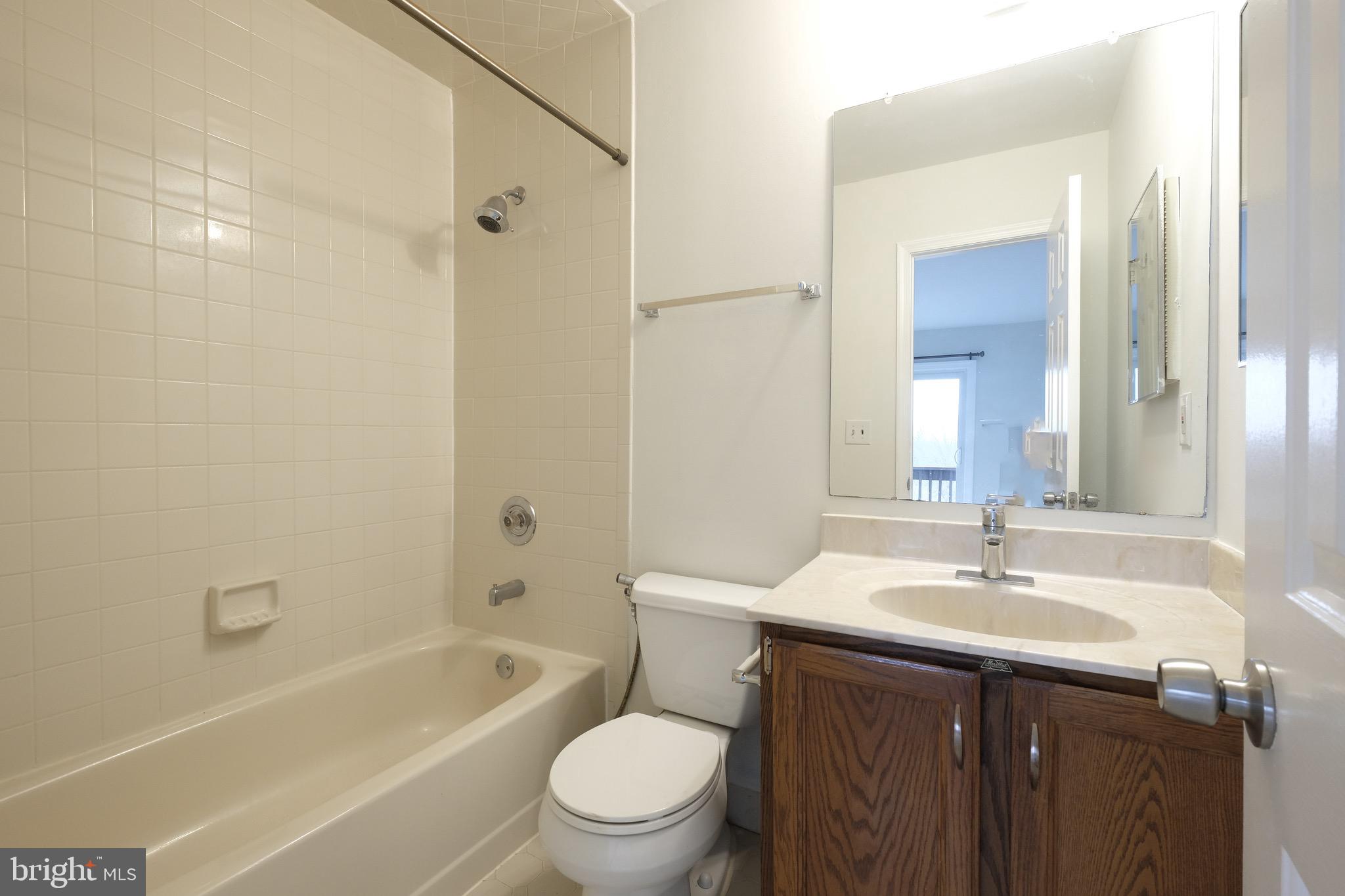 35 C Chicopee Drive Princeton, NJ 08540 - Photo 19 of 24 a bathroom with a sink a toilet and shower