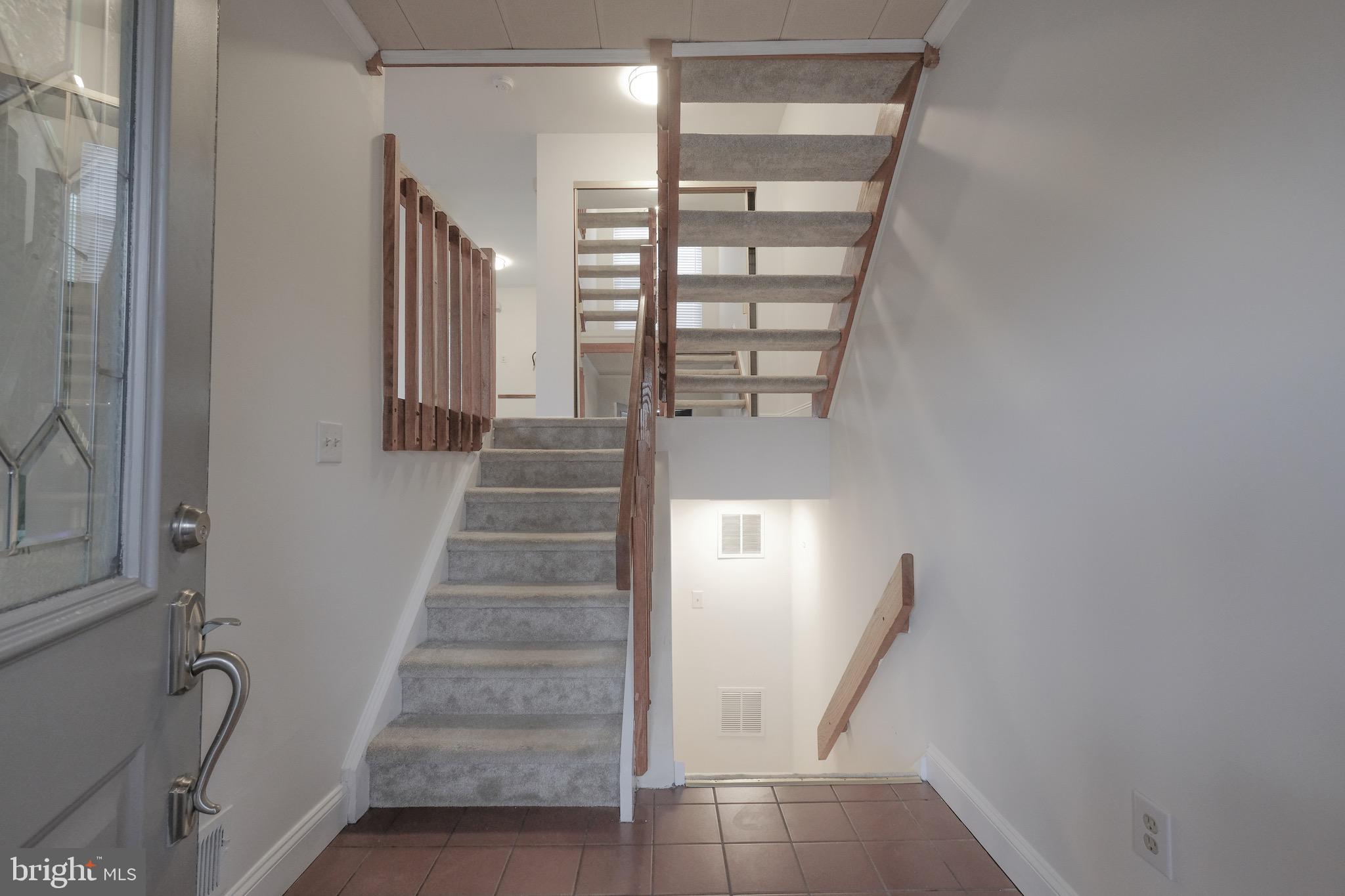 35 C Chicopee Drive Princeton, NJ 08540 - Photo 2 of 24 a view of entryway with wooden floor and stairs