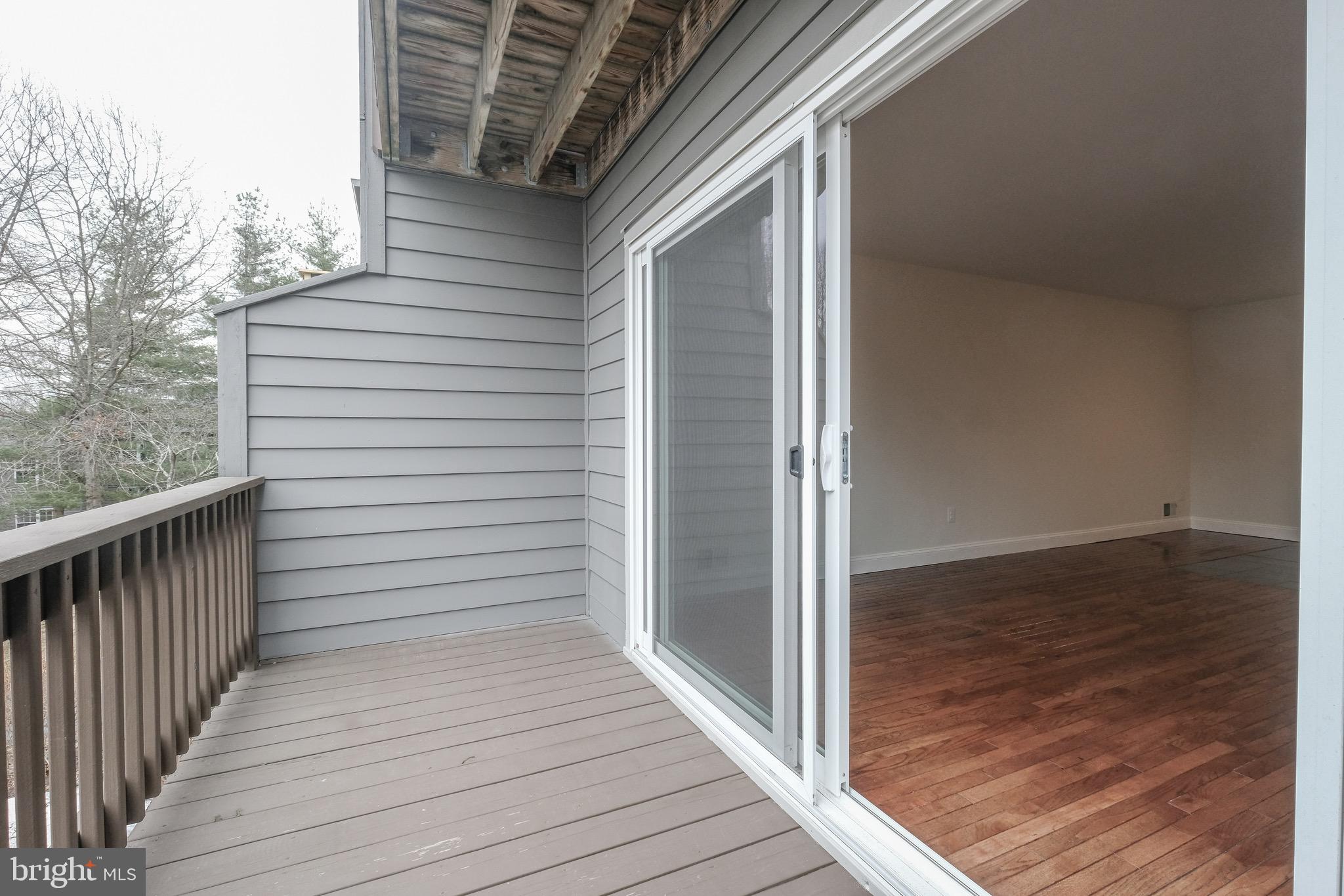 35 C Chicopee Drive Princeton, NJ 08540 - Photo 5 of 24 a view of a balcony with wooden floor