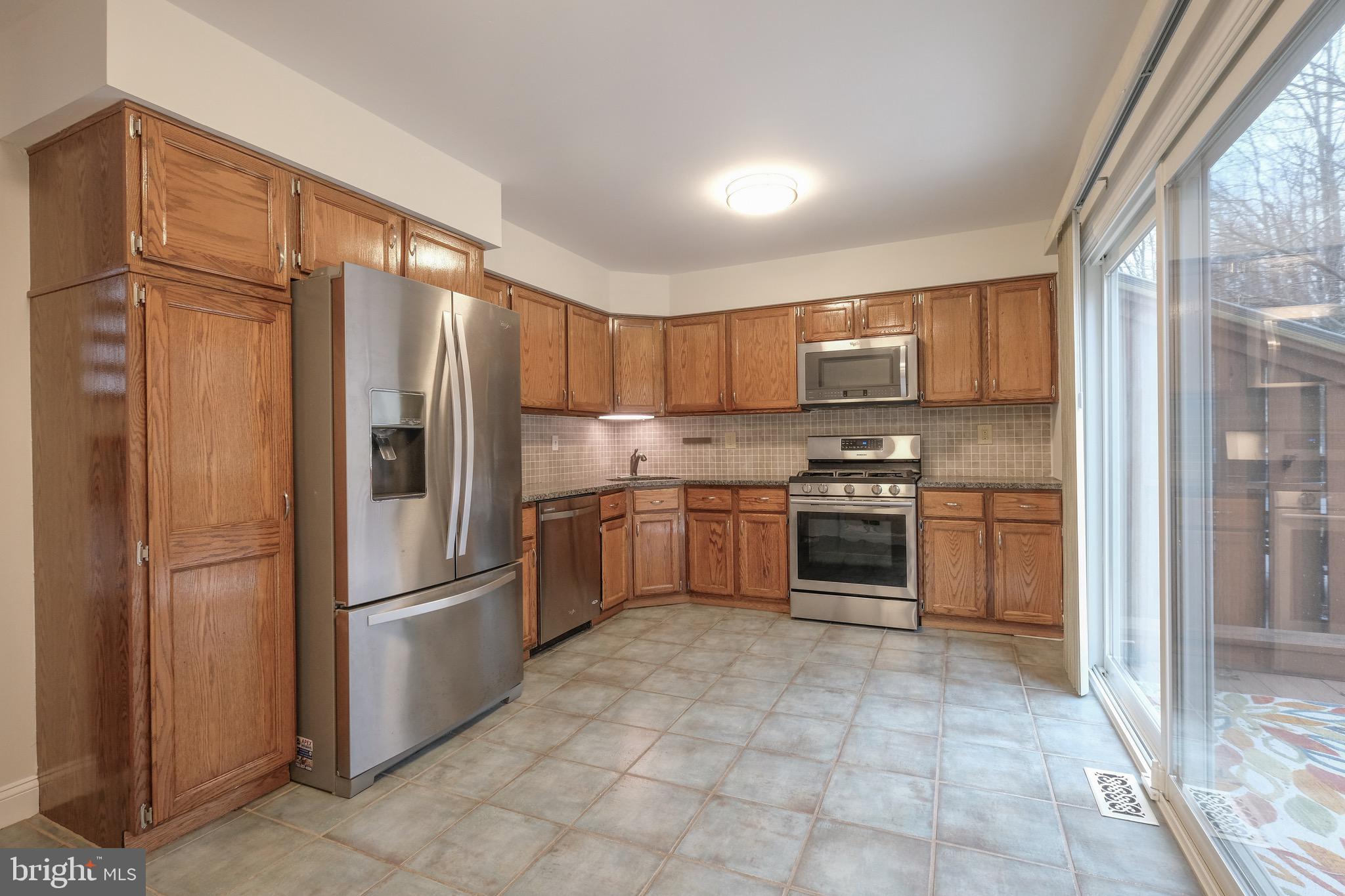 35 C Chicopee Drive Princeton, NJ 08540 - Photo 6 of 24 a kitchen with a refrigerator a stove a sink and a cabinets