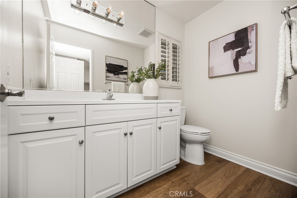 4 Abeto Irvine, CA 92620 - Photo 11 of 29 a bathroom with a toilet sink and mirror
