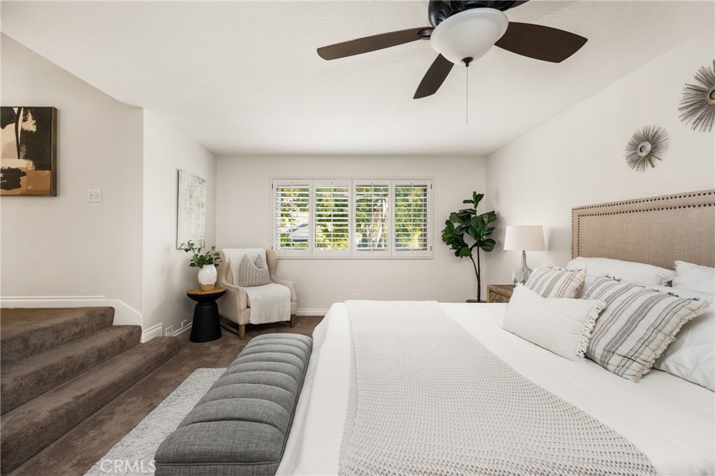 4 Abeto Irvine, CA 92620 - Photo 13 of 29 a bedroom with a large bed and a couch