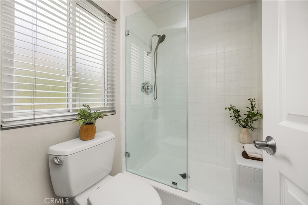 4 Abeto Irvine, CA 92620 - Photo 16 of 29 a bathroom with a toilet and a shower