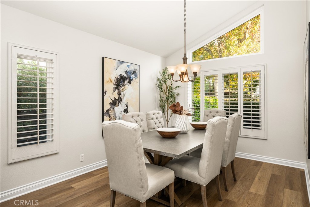 4 Abeto Irvine, CA 92620 - Photo 5 of 29 a dining room with furniture a rug and wooden floor