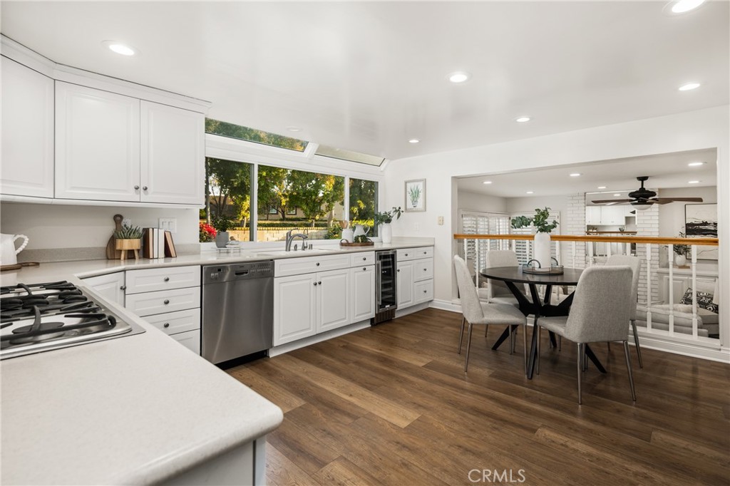 4 Abeto Irvine, CA 92620 - Photo 8 of 29 a kitchen with a table chairs stove and cabinets
