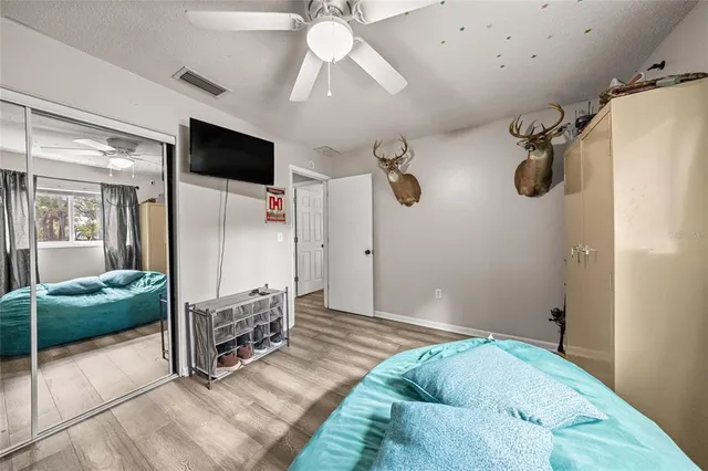 a spacious bedroom with a bed and walk in closet