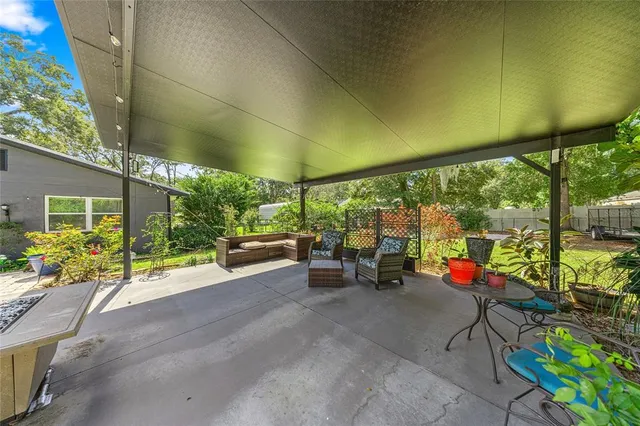 a living room with furniture and garden view