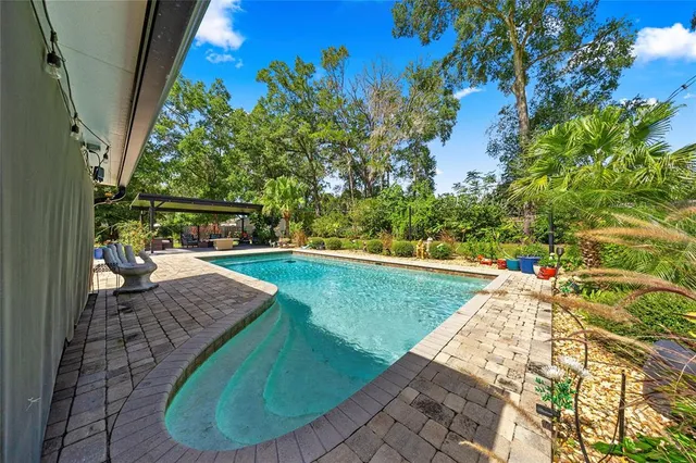 a view of a swimming pool with a patio