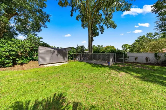 a backyard of a house with lots of green space