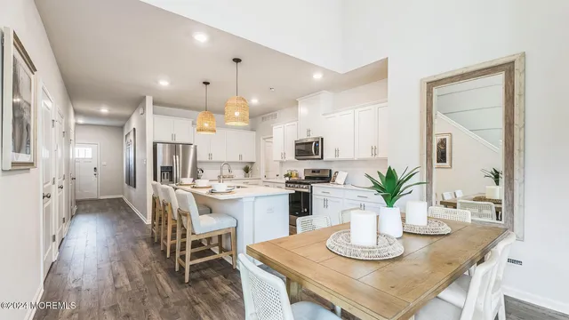 a kitchen with a table and chairs in it