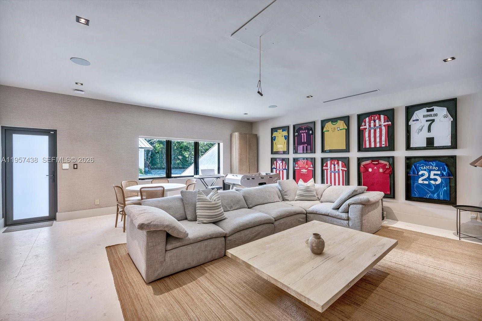 5902 Southwest 105th Street Pinecrest, FL 33156 - Photo 15 of 30 a living room with furniture and a large window