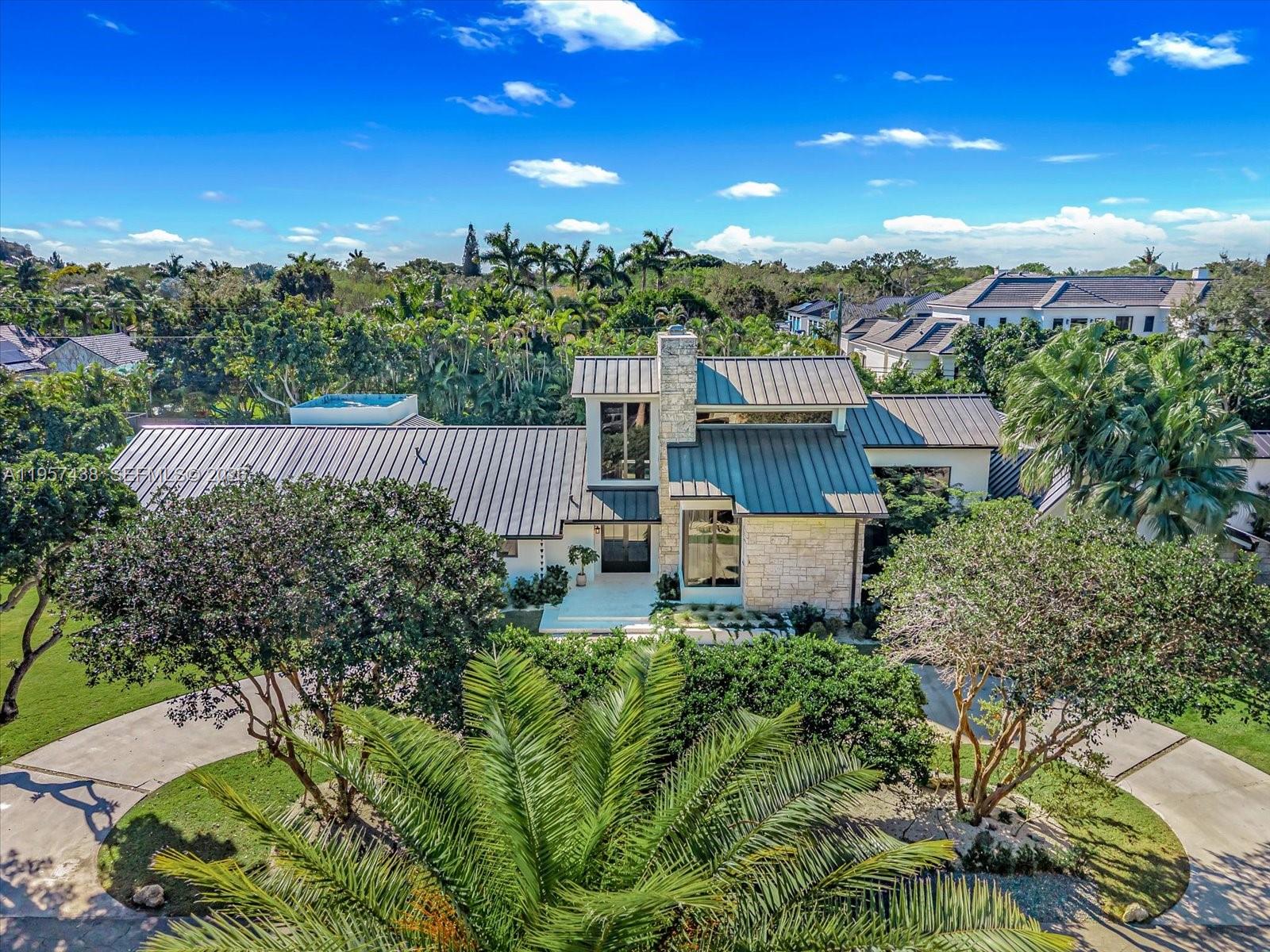 5902 Southwest 105th Street Pinecrest, FL 33156 - Photo 17 of 31 a view of a terrace with a garden