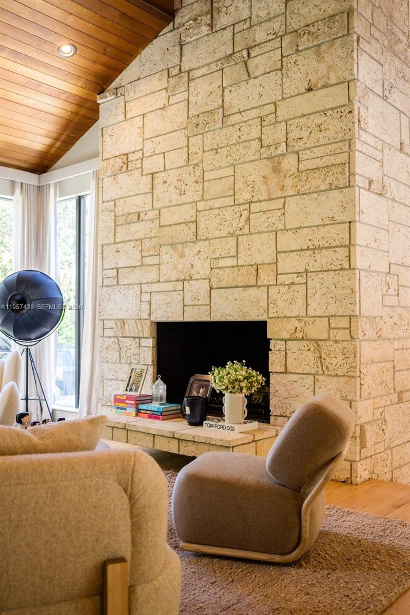 5902 Southwest 105th Street Pinecrest, FL 33156 - Photo 19 of 31 a living room with furniture and a fireplace