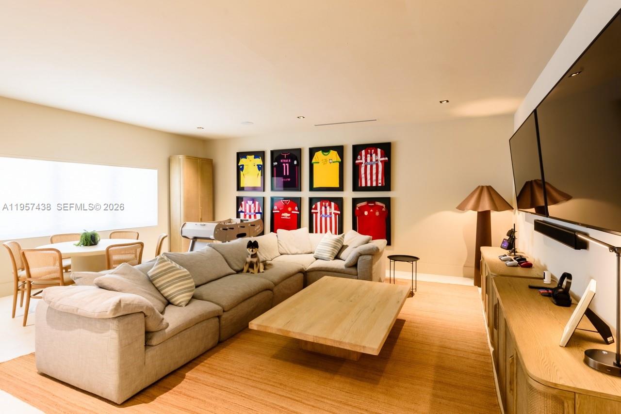 5902 Southwest 105th Street Pinecrest, FL 33156 - Photo 22 of 31 a living room with furniture and a flat screen tv