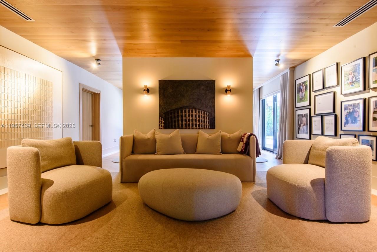 5902 Southwest 105th Street Pinecrest, FL 33156 - Photo 24 of 31 a living room with furniture and a large window