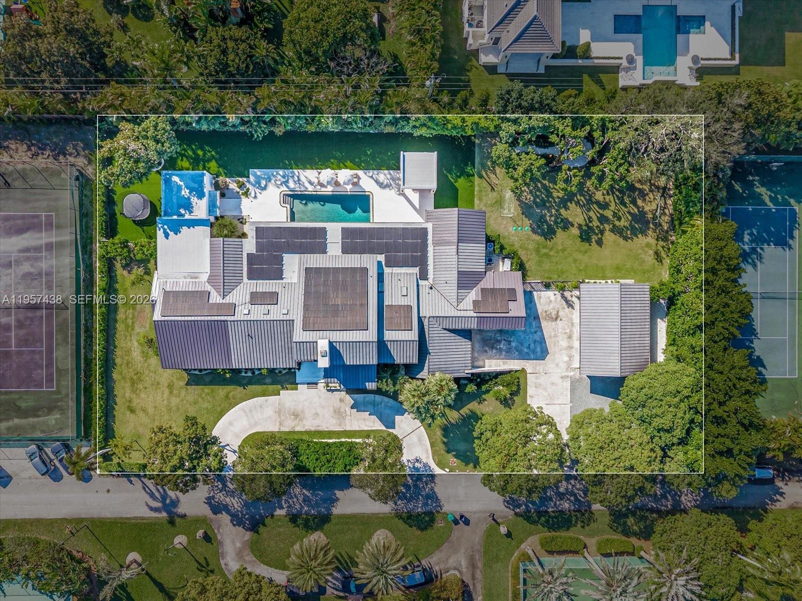 5902 Southwest 105th Street Pinecrest, FL 33156 - Photo 26 of 30 an aerial view of a house with a yard