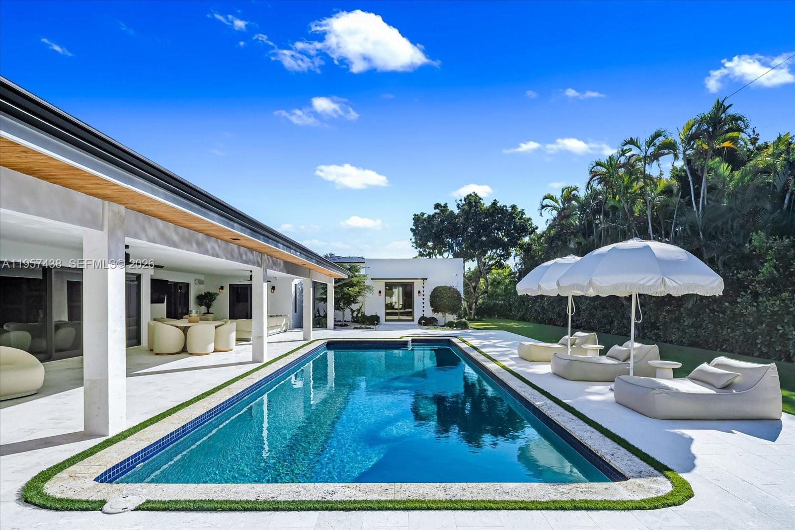 5902 Southwest 105th Street Pinecrest, FL 33156 - Photo 30 of 31 a swimming pool view with a seating space