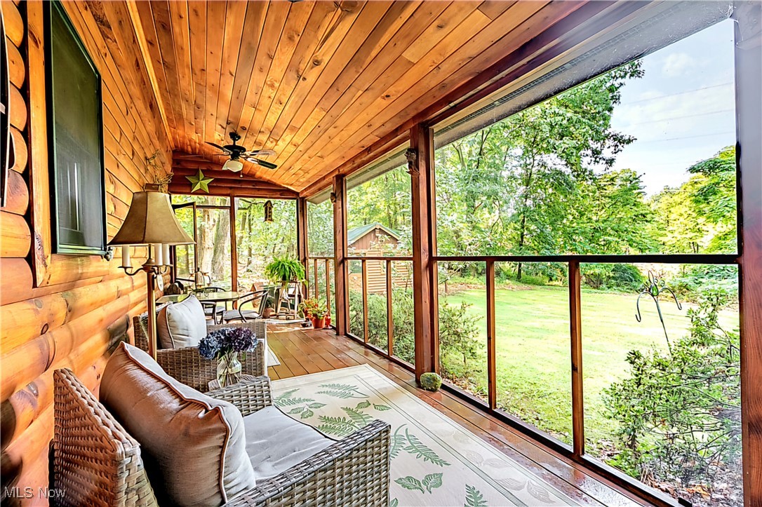 49144 Hickman Road Calcutta, OH 43920 - Photo 19 of 23 Sunroom featuring plenty of natural light, ceiling fan, vaulted ceiling, and wood ceiling
