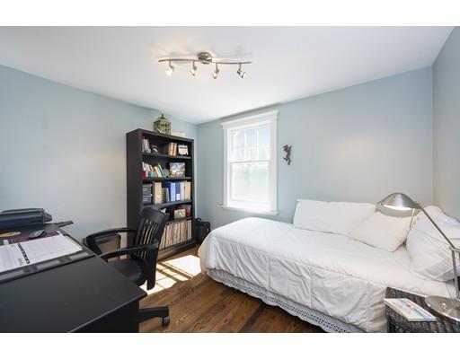 32 Bennett Road Marblehead, MA 01945 - Photo 9 of 24 a bedroom with a bed and a book shelf