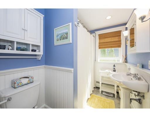 32 Bennett Road Marblehead, MA 01945 - Photo 10 of 24 a en suite bathroom with a sink mirror and a bathtub
