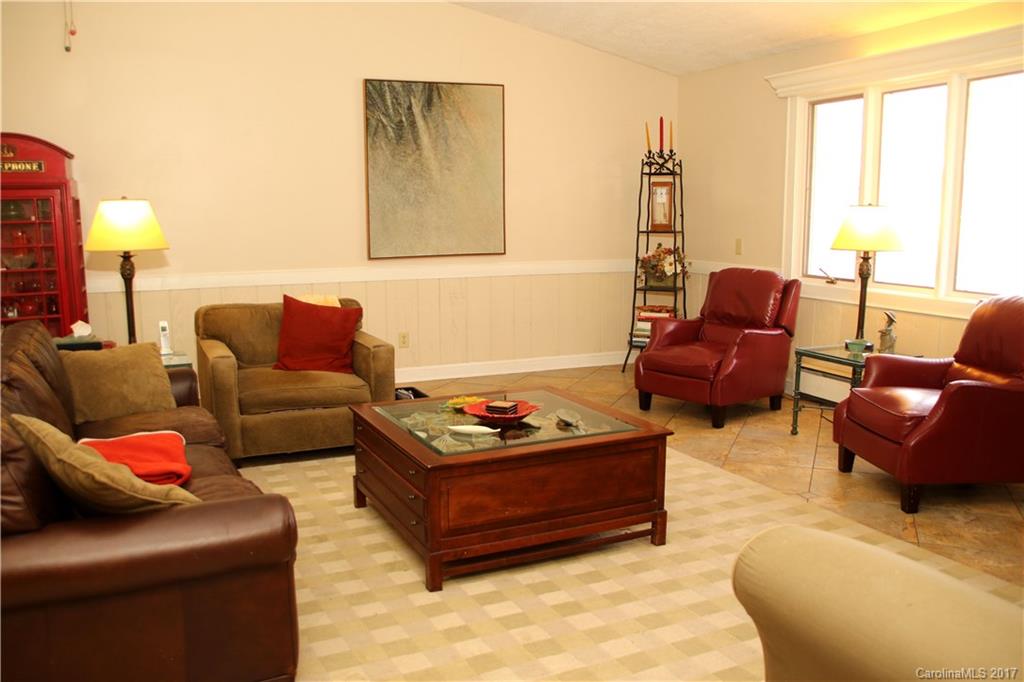 5608 Davis Road, Unit 20 Waxhaw, NC 28173 - Photo 12 of 21 a living room with furniture window and a lamp