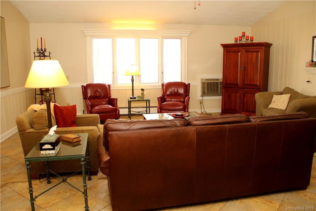 5608 Davis Road, Unit 20 Waxhaw, NC 28173 - Photo 13 of 21 a living room with furniture and a lamp