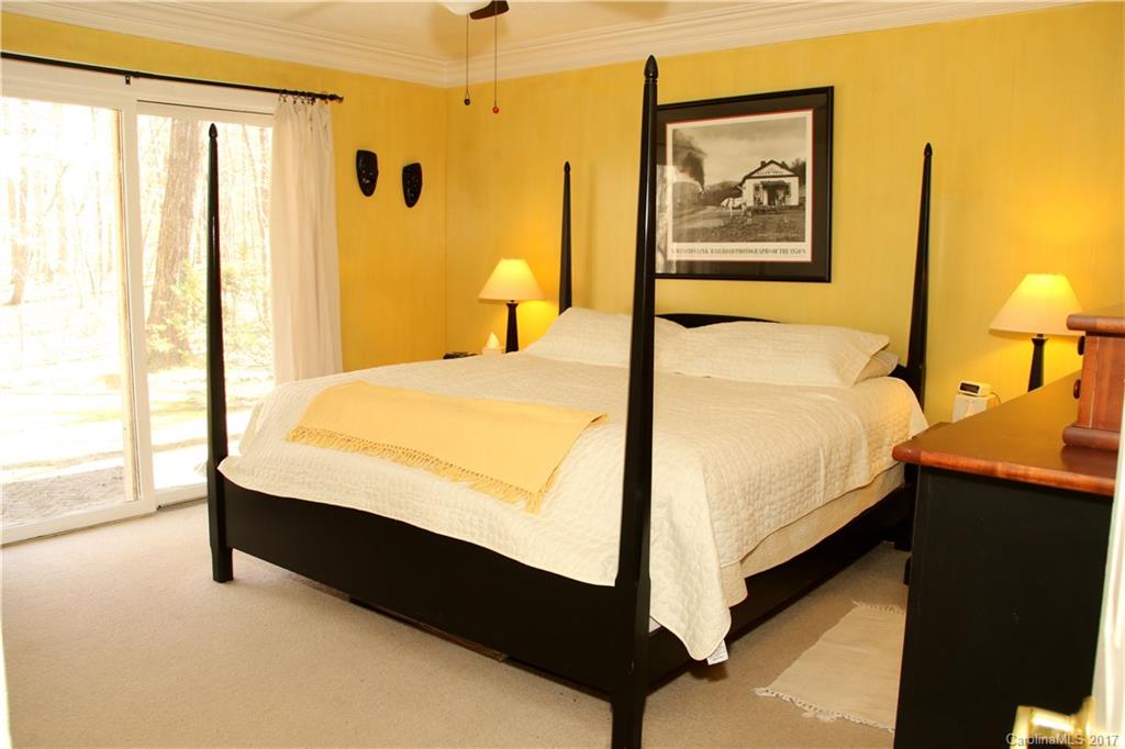 5608 Davis Road, Unit 20 Waxhaw, NC 28173 - Photo 15 of 21 a bedroom with a bed and wooden floor