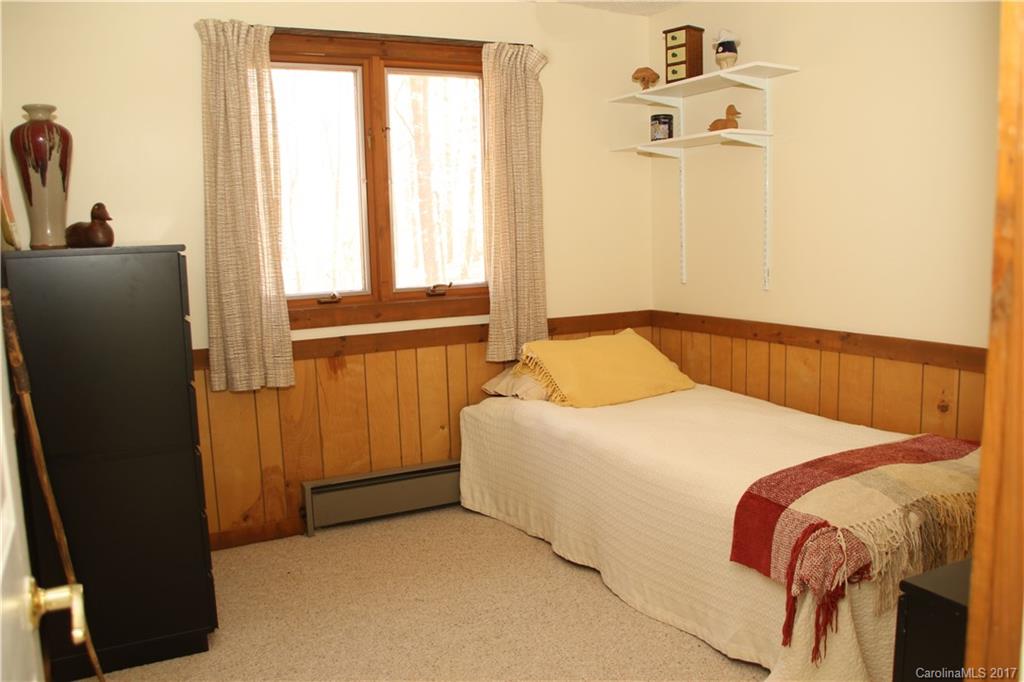 5608 Davis Road, Unit 20 Waxhaw, NC 28173 - Photo 19 of 21 a bedroom with a bed and next to a window