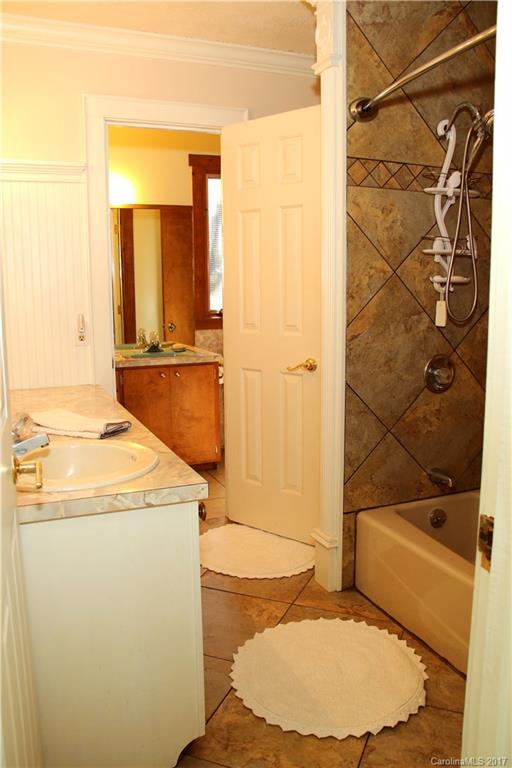5608 Davis Road, Unit 20 Waxhaw, NC 28173 - Photo 20 of 21 a bathroom with a sink and a mirror