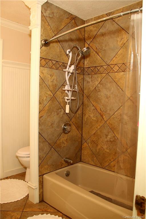 5608 Davis Road, Unit 20 Waxhaw, NC 28173 - Photo 21 of 21 a bathroom with a bathtub and a shower