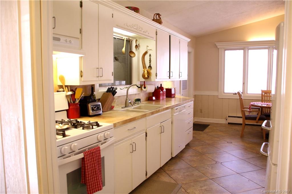 5608 Davis Road, Unit 20 Waxhaw, NC 28173 - Photo 10 of 21 a kitchen with stainless steel appliances a sink stove and cabinets