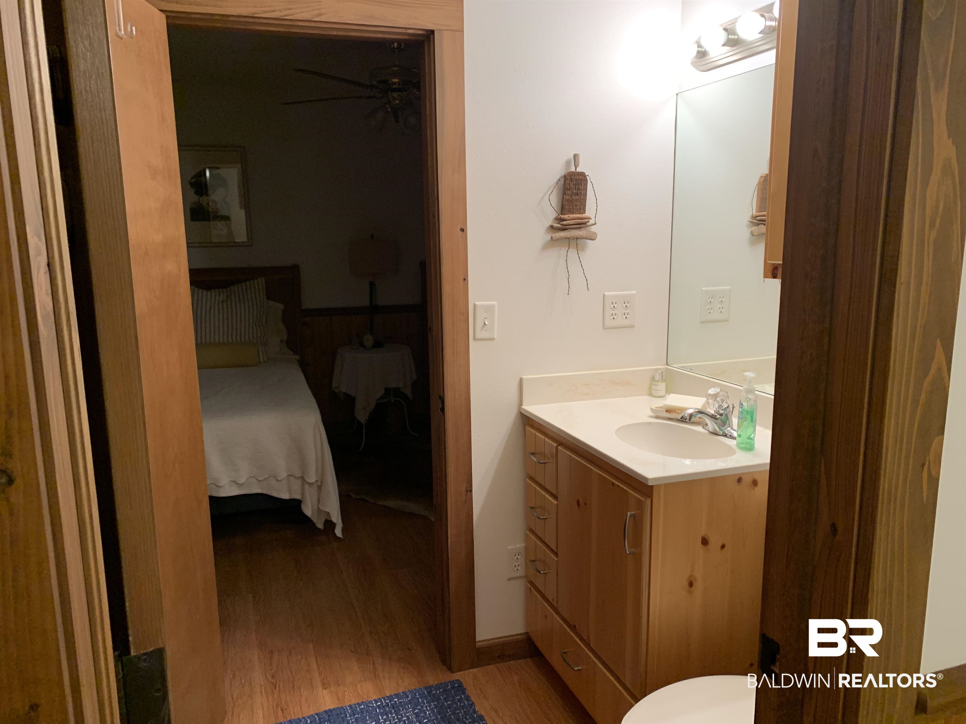 465 Rock Creek Road Wing, AL 36483 - Photo 10 of 15 Bathroom featuring vanity and hardwood / wood-style floors