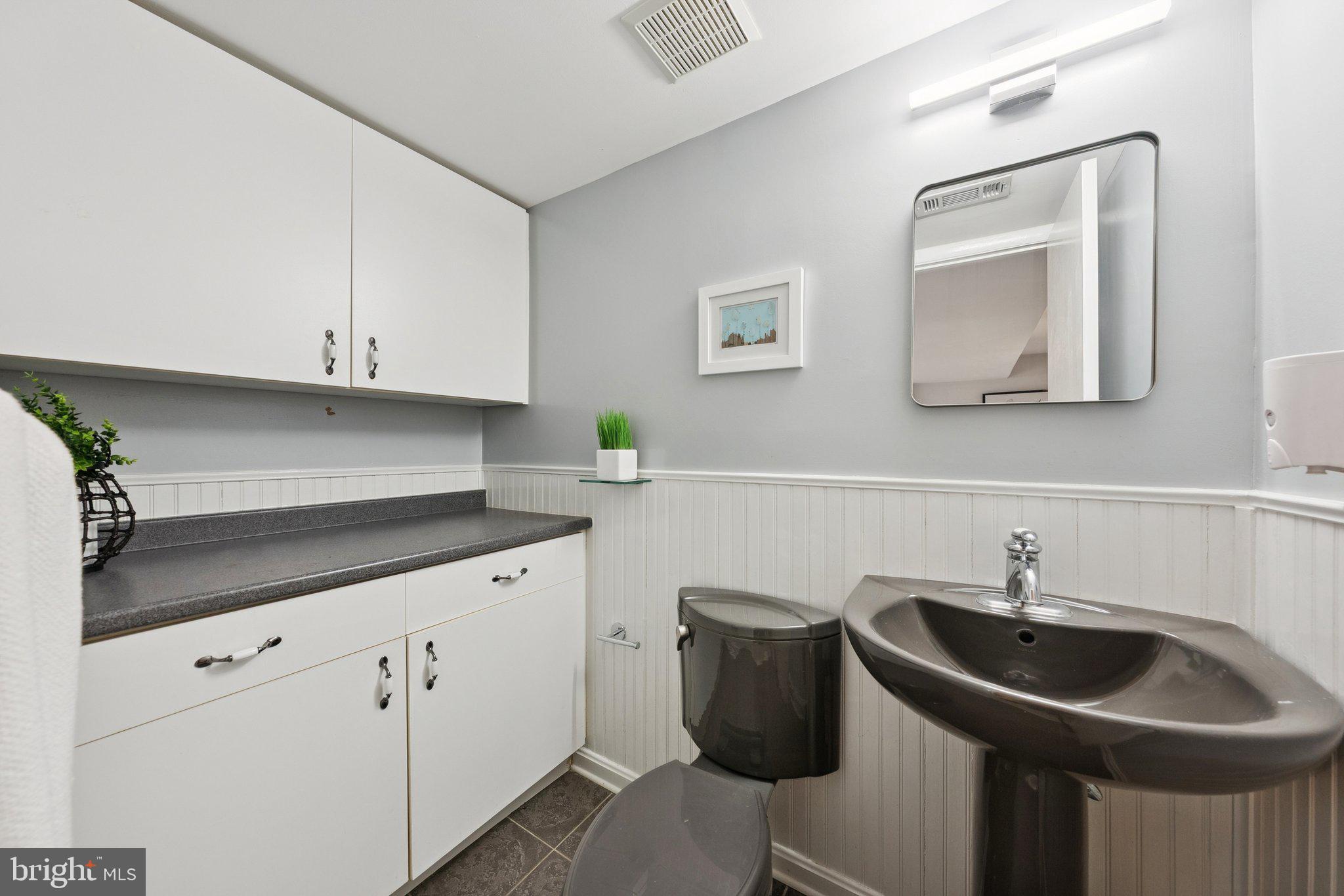 2404 Blue Valley Drive Silver Spring, MD 20904 - Photo 32 of 46 Powder room off great room w/new mirror & light