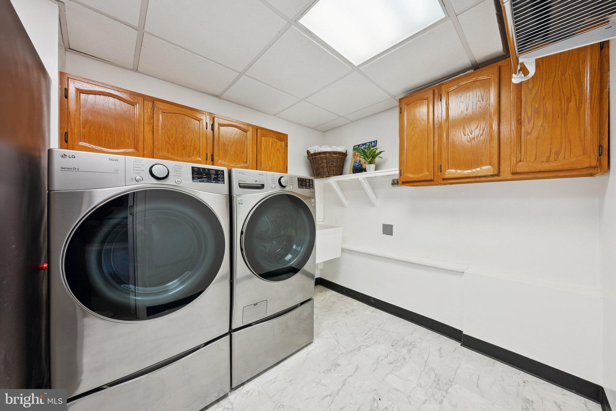 2404 Blue Valley Drive Silver Spring, MD 20904 - Photo 33 of 46 Large laundry room w/storage cabinets & fridge!