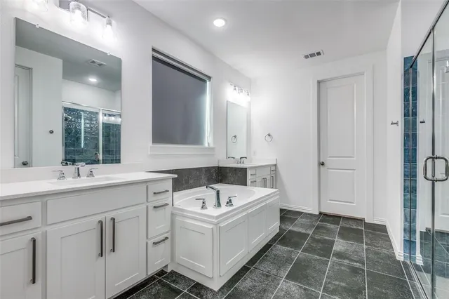 a bathroom with a sink and a bathtub